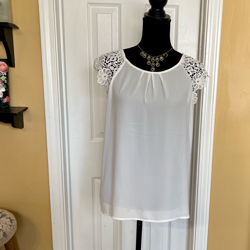 Lovely white lace flutter sleeved blouse